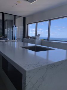 Book matched veins running down the 40mm waterfall ends