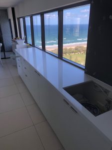 Intense White back bench in 20mm to leave the Island bench the focus